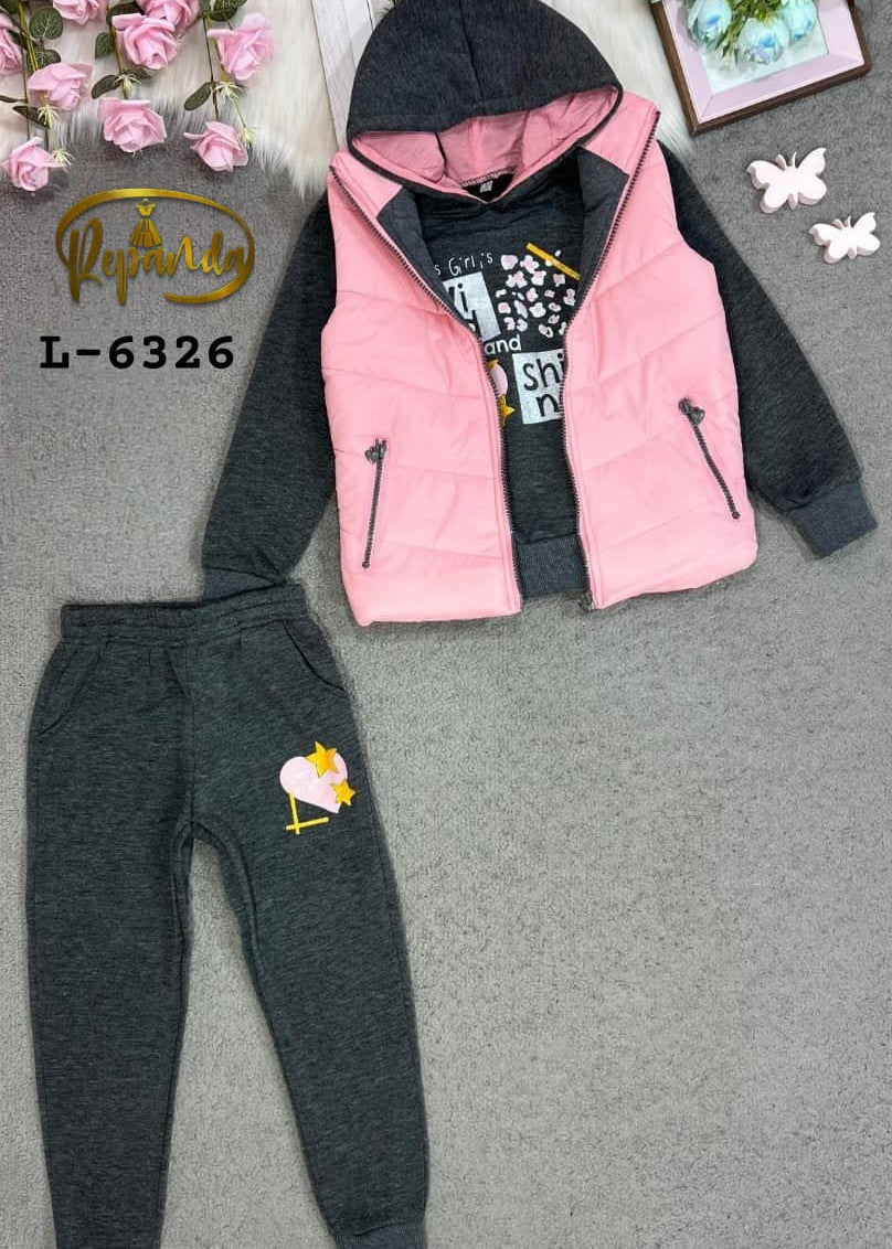 Children's outfit with pink vest, black hoodie, and gray pants on a gray surface.